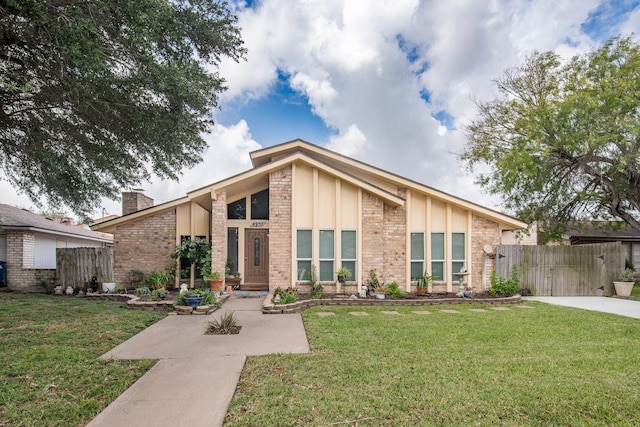4957 Shadowbend Dr, Corpus Christi, TX 78413 - mid-century inspired home featuring a chimney and brick siding