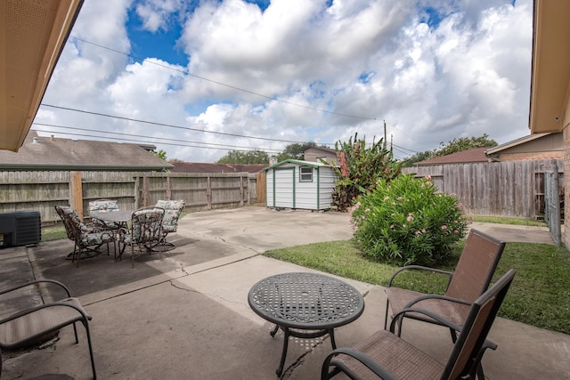 4957 Shadowbend Dr, Corpus Christi, TX 78413 - fenced backyard with a storage unit, a patio area, and outdoor dining space