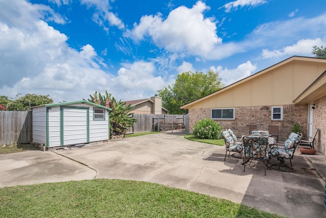 4957 Shadowbend Dr, Corpus Christi, TX 78413 - fenced backyard with a patio area and a storage shed