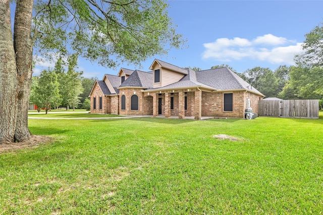 15908 Mcnorton, Splendora, TX 77372 - view of front of property with brick siding, a shingled roof, and a gate