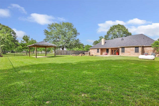15908 Mcnorton, Splendora, TX 77372 - fenced backyard with a gazebo and a patio