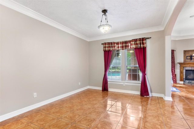 15908 Mcnorton, Splendora, TX 77372 - unfurnished room with ornamental molding, light tile patterned flooring, a glass covered fireplace, and a textured ceiling