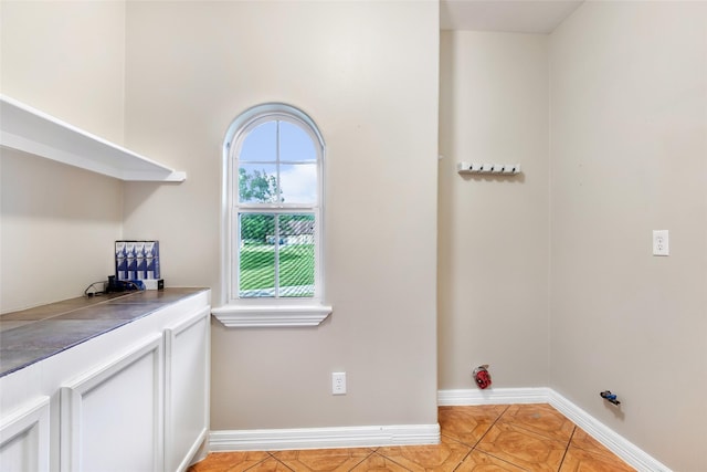 15908 Mcnorton, Splendora, TX 77372 - laundry area featuring baseboards and light tile patterned floors