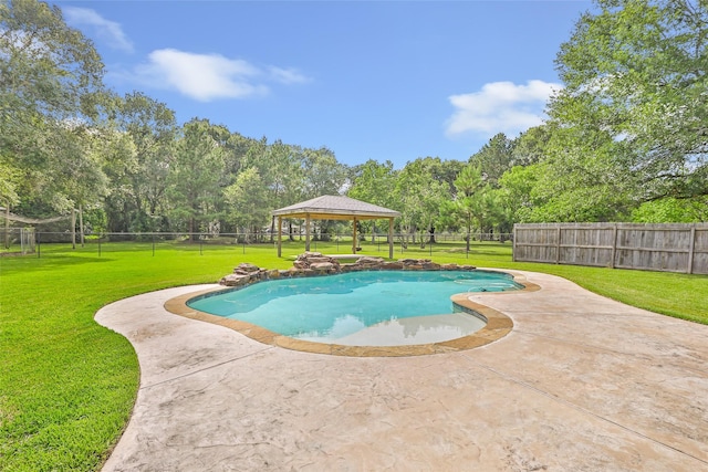 15908 Mcnorton, Splendora, TX 77372 - view of swimming pool featuring a gazebo, a fenced backyard, a patio, and view of wooded area