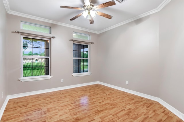 15908 Mcnorton, Splendora, TX 77372 - spare room featuring light wood-style floors, plenty of natural light, crown molding, and ceiling fan