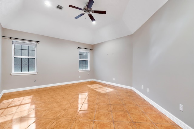 15908 Mcnorton, Splendora, TX 77372 - empty room with plenty of natural light, ceiling fan, light tile patterned floors, and lofted ceiling
