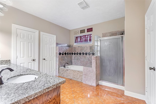 15908 Mcnorton, Splendora, TX 77372 - full bath featuring vanity, a garden tub, a shower stall, and tile patterned floors