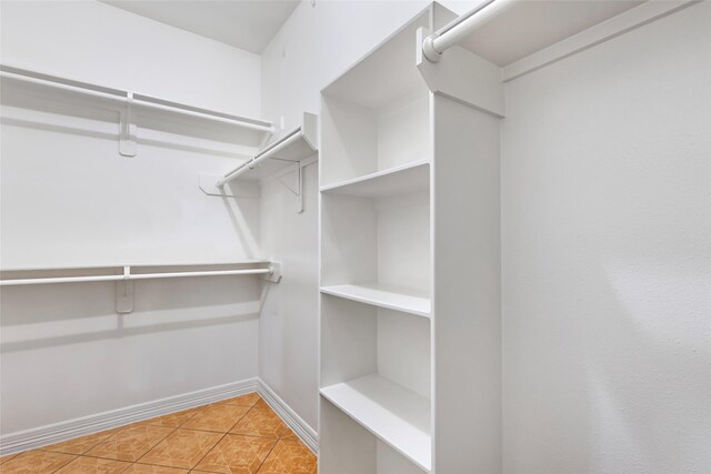 15908 Mcnorton, Splendora, TX 77372 - spacious closet featuring light tile patterned floors
