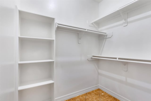 15908 Mcnorton, Splendora, TX 77372 - spacious closet featuring tile patterned flooring