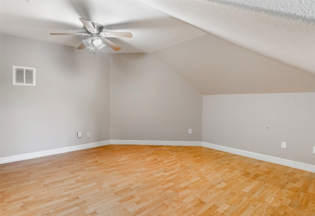 15908 Mcnorton, Splendora, TX 77372 - additional living space with light wood-style flooring, ceiling fan, and vaulted ceiling