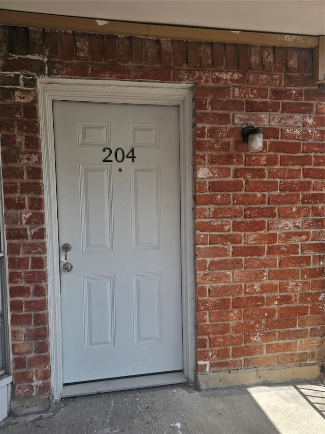 9201 Clarewood Dr Unit 204, Houston, TX 77036 - doorway to property with brick siding