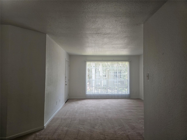 9201 Clarewood Dr Unit 204, Houston, TX 77036 - carpeted empty room with a textured wall and a textured ceiling