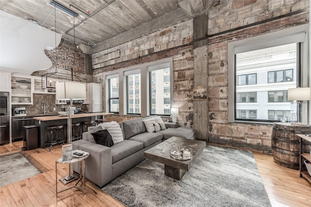 705 Main St Unit 801, Houston, TX 77002 - living room with light wood-style flooring and a towering ceiling