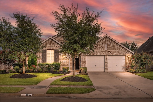 8903 Purdy Crescent Trl, Richmond, TX 77406 - view of front of house with brick siding, concrete driveway, a front yard, and an attached garage