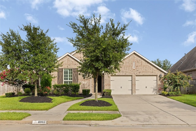 8903 Purdy Crescent Trl, Richmond, TX 77406 - obstructed view of property with brick siding, driveway, a garage, and a front yard