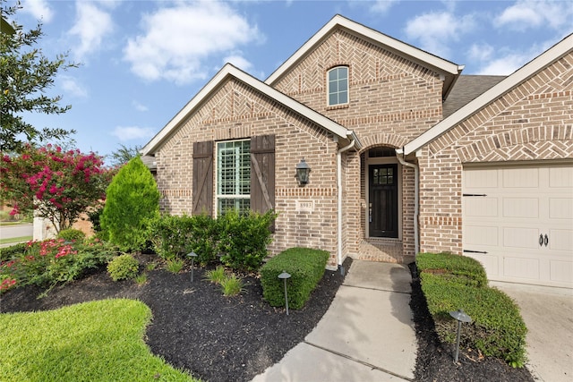 8903 Purdy Crescent Trl, Richmond, TX 77406 - view of front facade with brick siding and a garage