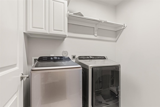8903 Purdy Crescent Trl, Richmond, TX 77406 - laundry room featuring independent washer and dryer and cabinet space