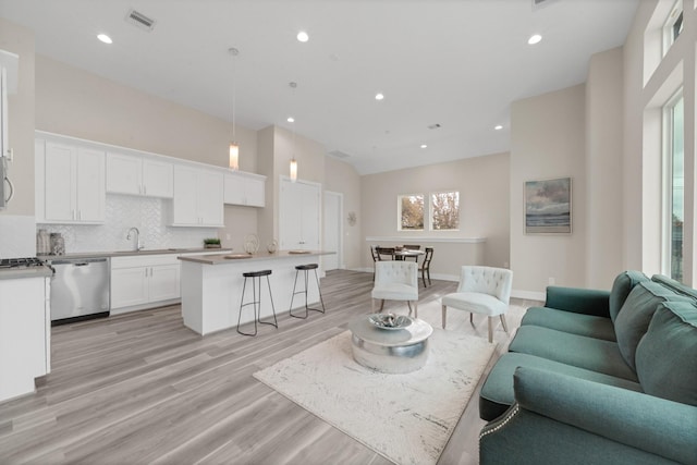 2504 W Tidwell Rd Unit C, Houston, TX 77091 - living room with light wood finished floors and recessed lighting