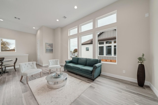 2504 W Tidwell Rd Unit C, Houston, TX 77091 - living room featuring light wood-style flooring and recessed lighting
