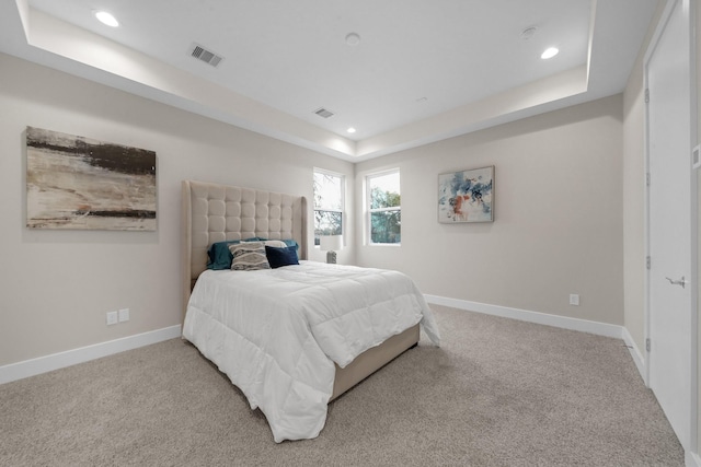 2504 W Tidwell Rd Unit C, Houston, TX 77091 - bedroom with light colored carpet, recessed lighting, and a raised ceiling