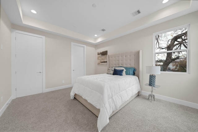 2504 W Tidwell Rd Unit C, Houston, TX 77091 - carpeted bedroom featuring a tray ceiling and recessed lighting