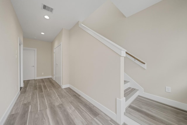 2504 W Tidwell Rd Unit C, Houston, TX 77091 - hallway featuring wood finished floors, stairway, and recessed lighting