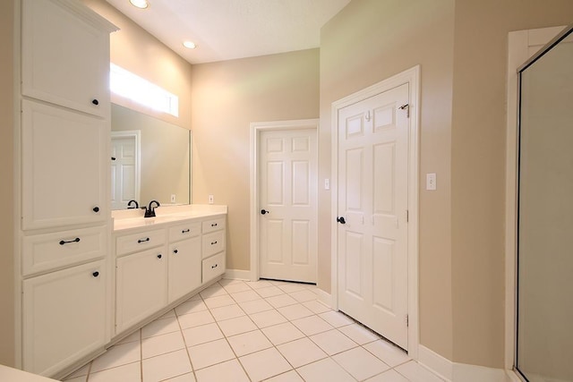 36218 Post Oak Cir, Magnolia, TX 77355 - full bathroom featuring vanity, a stall shower, tile patterned floors, and recessed lighting