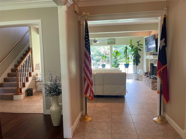 36218 Post Oak Cir, Magnolia, TX 77355 - corridor featuring crown molding, stairs, and tile patterned floors