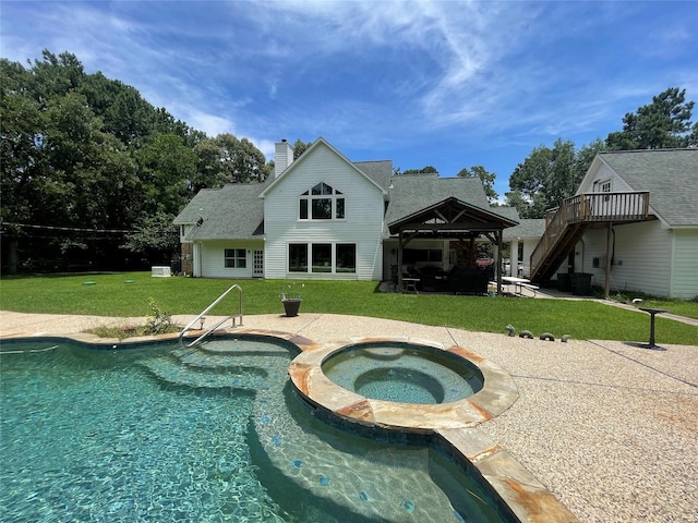 36218 Post Oak Cir, Magnolia, TX 77355 - back of house with a chimney, a yard, a patio area, and stairway