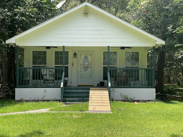 36218 Post Oak Cir, Magnolia, TX 77355 - bungalow-style home featuring a porch, ceiling fan, and a front yard