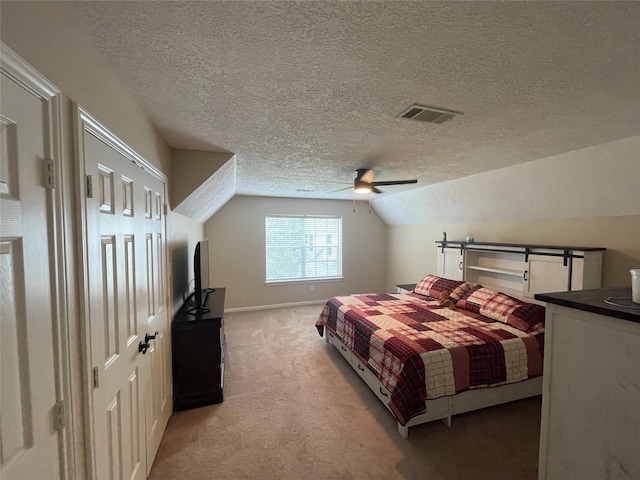 36218 Post Oak Cir, Magnolia, TX 77355 - bedroom with light colored carpet, a textured ceiling, vaulted ceiling, and a ceiling fan