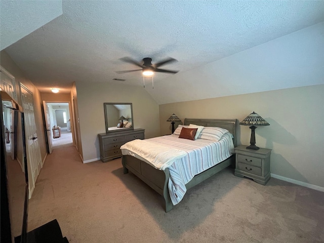 36218 Post Oak Cir, Magnolia, TX 77355 - bedroom with light colored carpet, a textured ceiling, a ceiling fan, and lofted ceiling