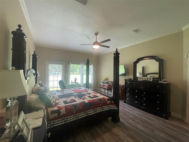 36218 Post Oak Cir, Magnolia, TX 77355 - bedroom featuring wood finished floors, a textured ceiling, ornamental molding, and ceiling fan