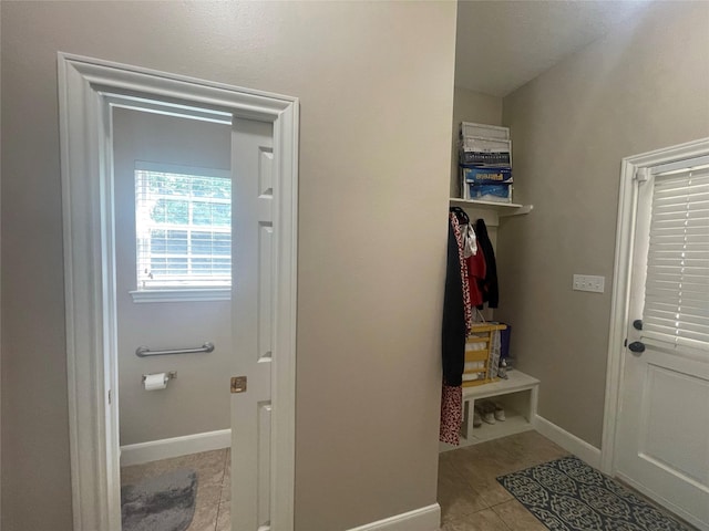 36218 Post Oak Cir, Magnolia, TX 77355 - mudroom featuring tile patterned floors and baseboards