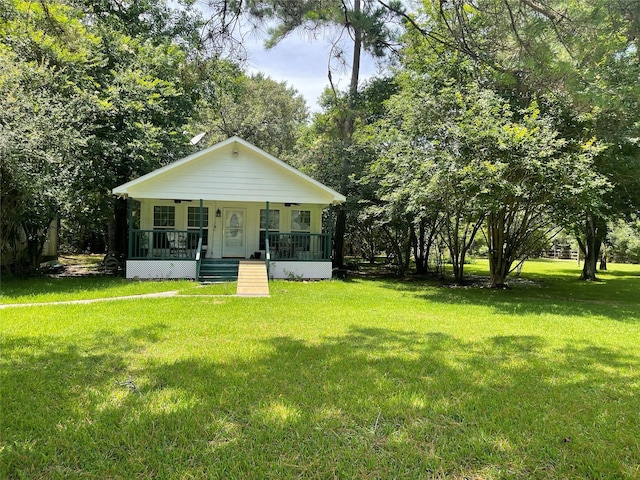 36218 Post Oak Cir, Magnolia, TX 77355 - view of front of property with a porch and a front lawn