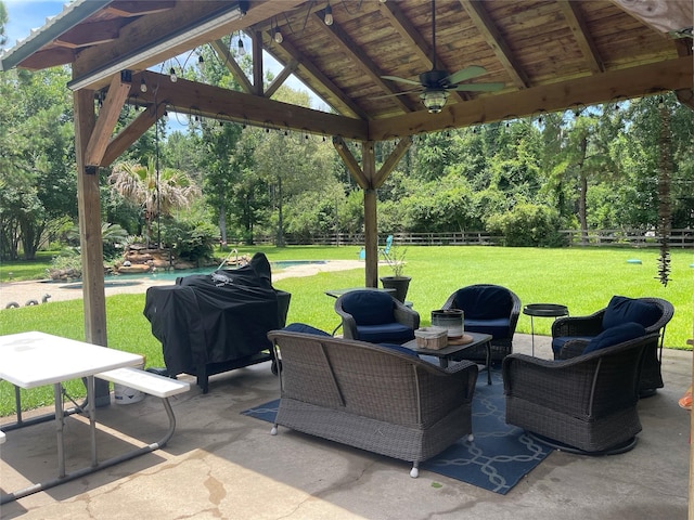 36218 Post Oak Cir, Magnolia, TX 77355 - fenced backyard with a gazebo, a ceiling fan, a patio area, and view of wooded area