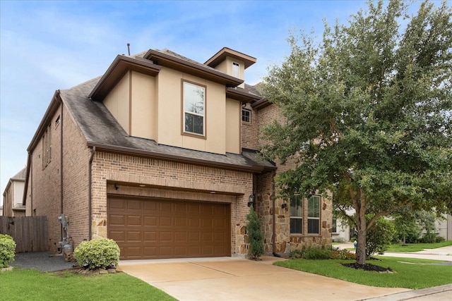 13223 Parkway Spring Dr, Houston, TX 77077 - view of front of home with brick siding, driveway, an attached garage, stucco siding, and a shingled roof