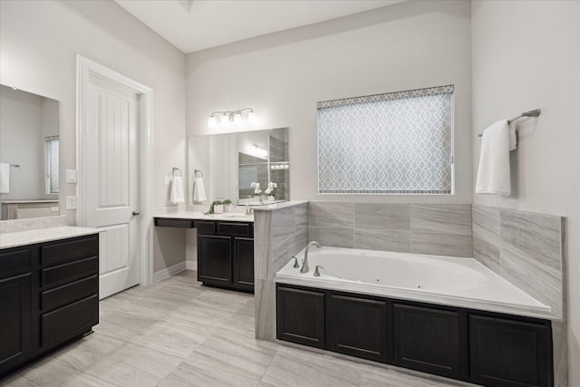 13223 Parkway Spring Dr, Houston, TX 77077 - bathroom with a whirlpool tub, two vanities, and tiled shower