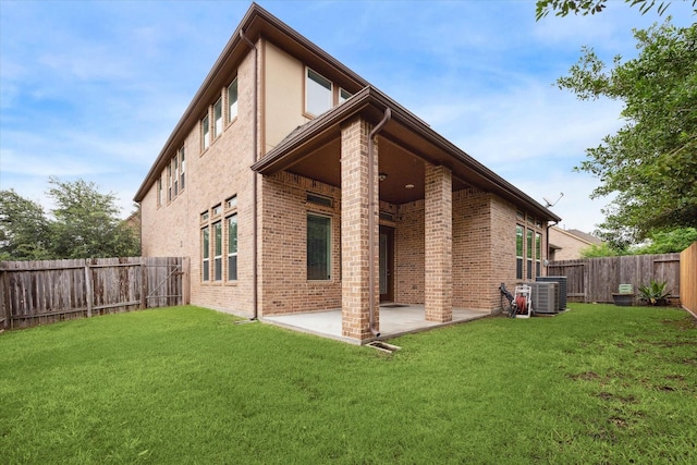 13223 Parkway Spring Dr, Houston, TX 77077 - back of house with a fenced backyard, a patio area, and brick siding