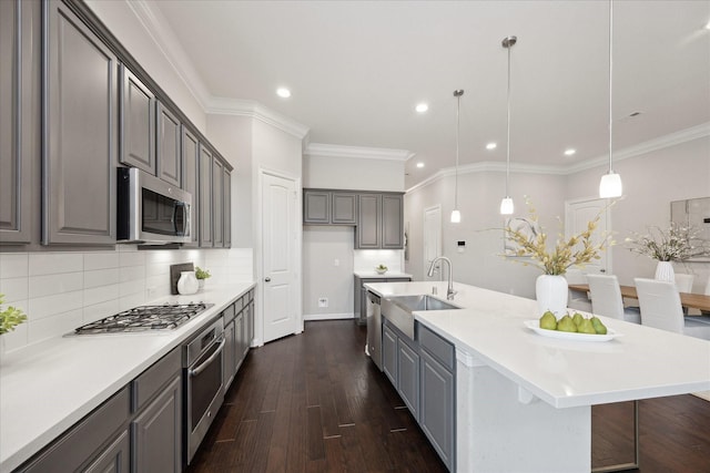 13223 Parkway Spring Dr, Houston, TX 77077 - kitchen with stainless steel appliances, gray cabinets, dark wood-style flooring, decorative backsplash, and crown molding