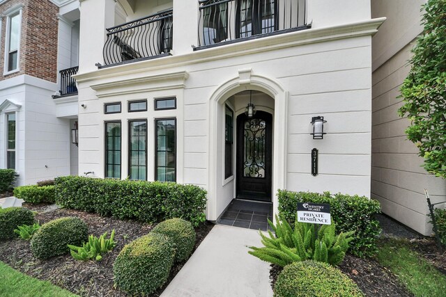 3711 Somerset Commons Ln, Houston, TX 77055 - view of exterior entry with a balcony