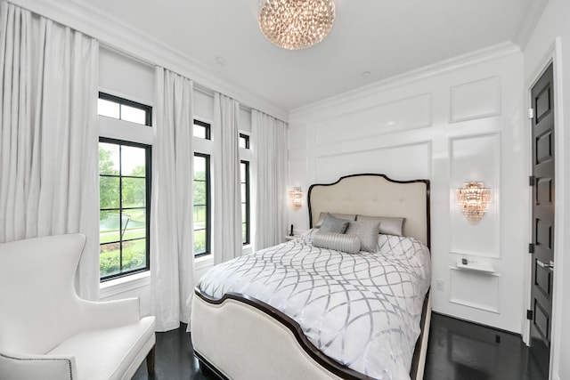 3711 Somerset Commons Ln, Houston, TX 77055 - bedroom featuring ornamental molding, a chandelier, and a decorative wall