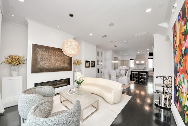 3711 Somerset Commons Ln, Houston, TX 77055 - living room featuring ornamental molding, recessed lighting, a glass covered fireplace, and dark wood-style floors