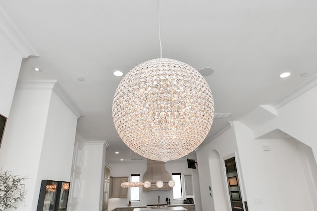 3711 Somerset Commons Ln, Houston, TX 77055 - detailed view of a chandelier, ornamental molding, recessed lighting, and arched walkways