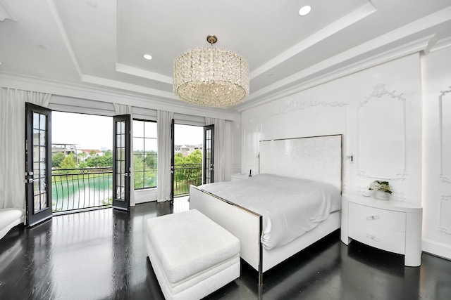3711 Somerset Commons Ln, Houston, TX 77055 - bedroom with a tray ceiling, access to exterior, recessed lighting, a chandelier, and a water view