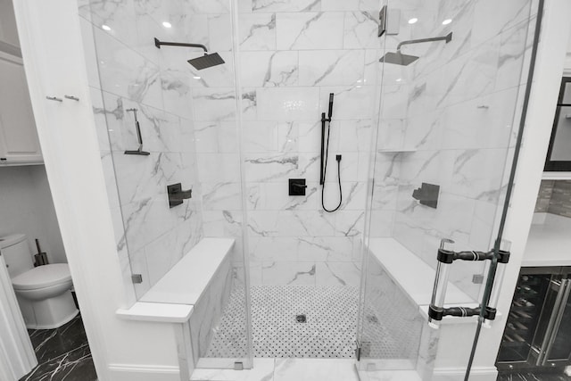 3711 Somerset Commons Ln, Houston, TX 77055 - bathroom with marble look tile flooring and a stall shower