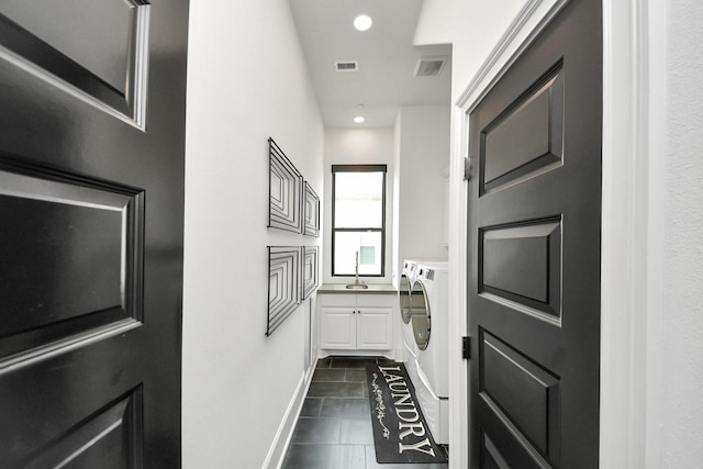 3711 Somerset Commons Ln, Houston, TX 77055 - doorway featuring separate washer and dryer, dark tile patterned floors, and recessed lighting