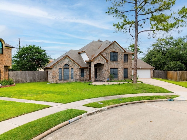 10422 Springland Ct, Houston, TX 77065 - french country home featuring brick siding, concrete driveway, and a shingled roof