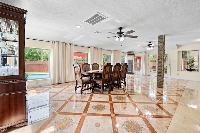 10422 Springland Ct, Houston, TX 77065 - dining room with healthy amount of natural light, light tile patterned flooring, a textured ceiling, ceiling fan, and recessed lighting