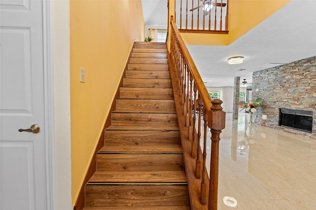 10422 Springland Ct, Houston, TX 77065 - stairway with a stone fireplace